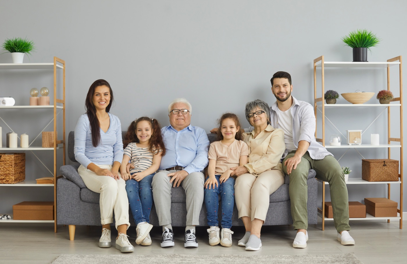 A happy multigenerational family together on the sofa at home