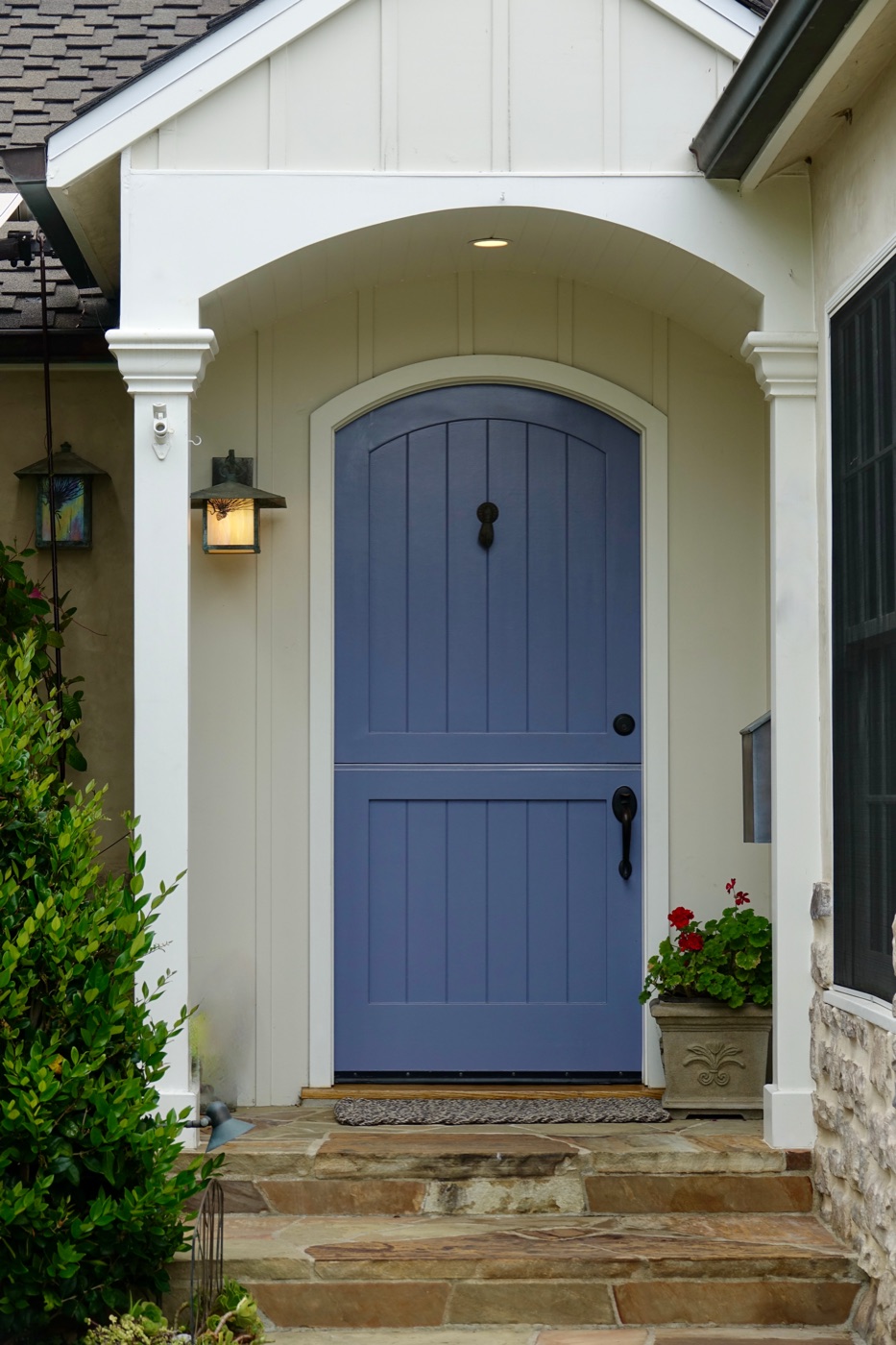 The warm craftsman-style entrance of a well-kept home